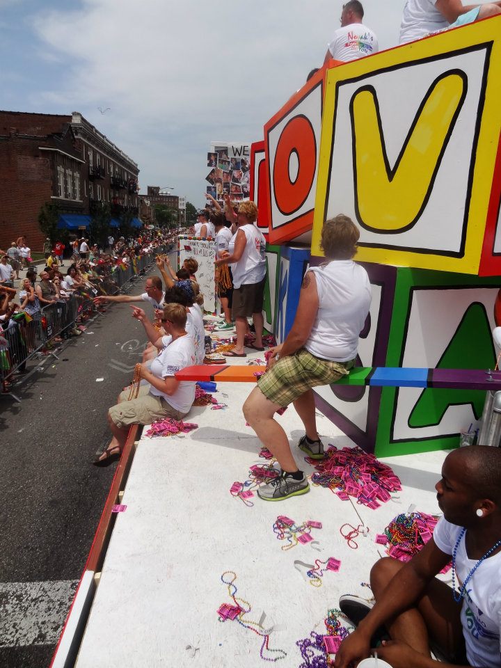 On the Novaks Float, throwing out beads with free shot coupons! Photo