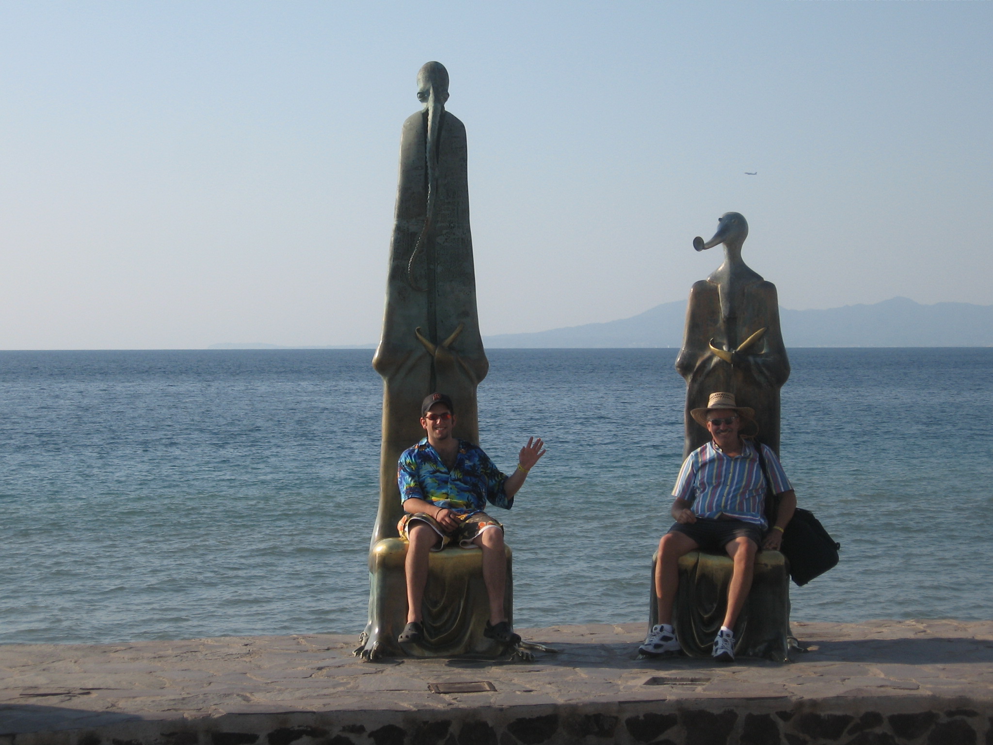 friends posing with weird sculptures Photo